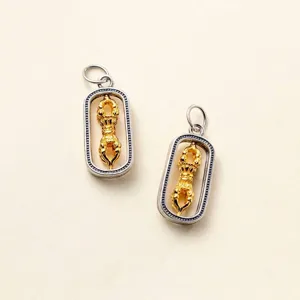 Detailed view of handcrafted 925 sterling silver rotatable gold Vajra pendant charm