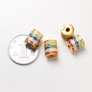 Close-up of 925 sterling silver barrel beads with colorful enamel wave patterns and S925 mark