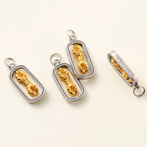 Detailed view of 925 sterling silver antique rotatable gold-plated Vajra pendant charms