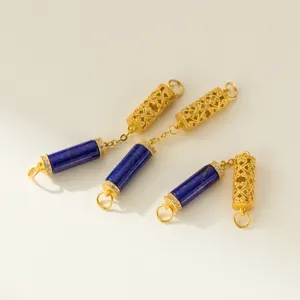 Close-up detail of lapis lazuli and hollow gold pendants for DIY jewelry making.