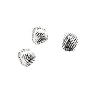 Detail of 925 sterling silver distressed striped triangular spacer beads for DIY.