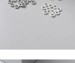 Close-up of S925 sterling silver open jump rings for DIY jewelry making and repair.