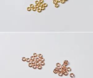 Macro view of gold and rose gold S925 silver open jump rings for DIY jewelry making