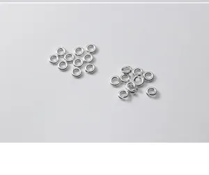Macro detail of S925 sterling silver open and closed jump rings for jewelry DIY