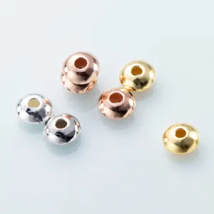 Detailed view of S925 silver flat spacer beads in silver, gold, and rose gold finishes for DIY.
