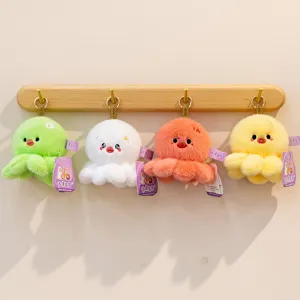Set of four colorful plush octopus keychains hanging on a wooden wall rack