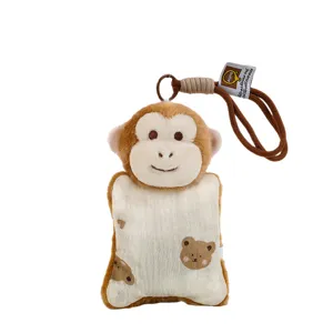 Cute plush monkey keychain pendant for backpack decoration, soft bean bag toy charm