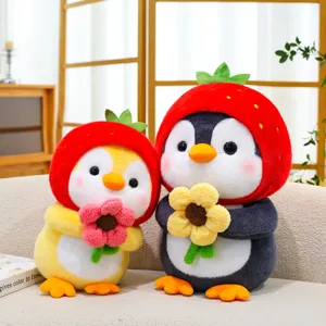 Adorable penguin plush toys wearing strawberry hats and holding colorful flowers