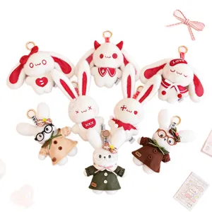 Set of cute plush bunny keychains with glasses and colorful dresses for Easter