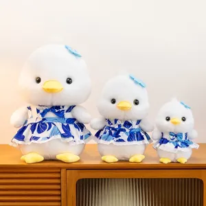 Cute white duck plush toy set featuring blue floral dresses in three different sizes