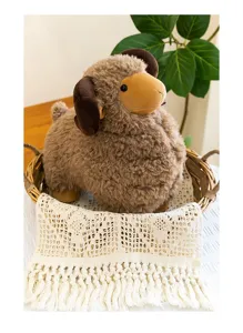 Detailed shot of a cute brown big-horned ram plush toy sitting in a wicker basket