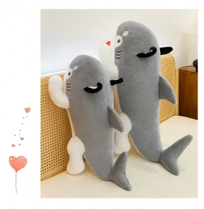 Detailed side view of two creative shark dog plush pillows on a cozy bed headboard