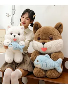 Close-up of cute cat plush toys holding blue fish, shown with a model for scale and detail