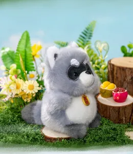 Cute raccoon plush toy with a golden 'Auspicious' tag in a forest-themed setting.