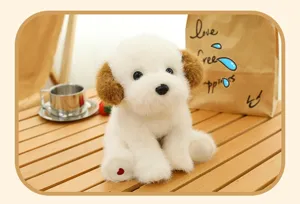 Close-up of a cute white plush puppy toy with soft brown ears and heart embroidery detail