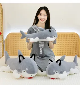 Creative shark dog plush toy bolster pillow shown in a cozy home bedroom setting