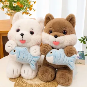 Two cute cat plush toys holding blue fish, available in white and brown colors