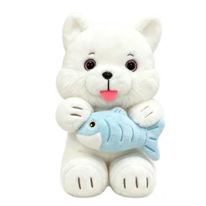 Cute white plush cat toy holding a blue fish, soft stuffed animal doll for kids decor