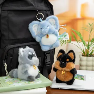 Set of cute plush animal keychains featuring blue elephant, grey raccoon, and puppy dog