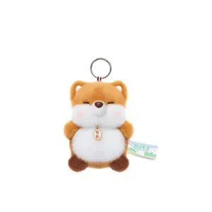 Cute Shiba Inu plush keychain toy with soft brown fur and auspicious golden charm
