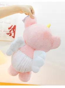 Detailed back view of a soft pink winged rabbit plush toy being held by a human hand