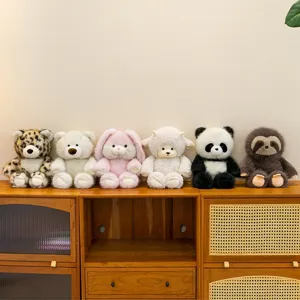 Collection of cute animal plush toys including panda, lamb, and sloth on a wooden cabinet.