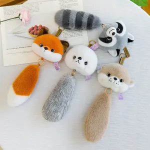 Set of cute plush animal head keychains featuring fox, raccoon, and otter designs.