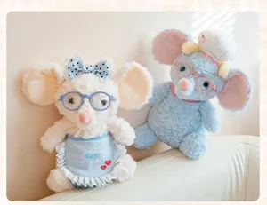 Close-up detail of two cute baking-themed plush mouse dolls with glasses and chef's hat