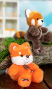 Close-up of cute forest animal plush pendants featuring orange fox and brown red panda