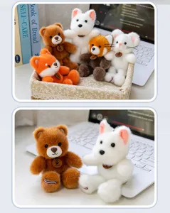 Close-up view of soft forest animal plush pendants featuring a cute brown bear and white dog