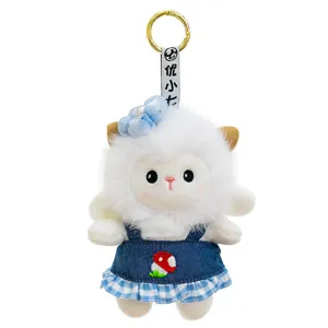Cute sheep plush keychain wearing a blue denim dress with mushroom embroidery