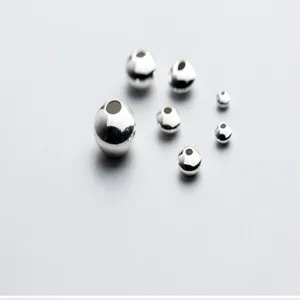 Close-up detail of shiny sterling silver spacer beads, perfect for DIY jewelry crafting.