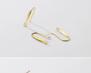 Close-up of S925 sterling silver gold-plated ear hook components for DIY jewelry making