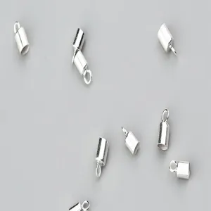 Detailed macro view of S925 sterling silver 2-4mm cord ends for DIY jewelry making.