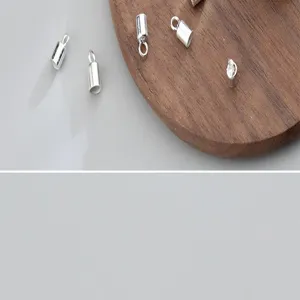 Detailed macro view of silver tube cord end caps for handmade DIY jewelry crafts