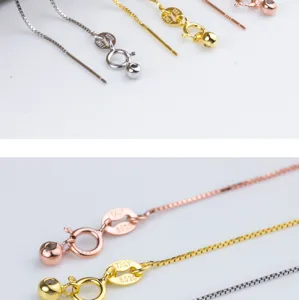 Dettaglio macro delle chiusure a catena con ago in argento S925 in oro, argento e oro rosa