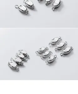 Macro detail of S925 sterling silver pea-shaped clasps for DIY jewelry making.