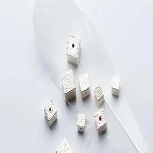 Detail view of textured S925 sterling silver striped square spacer beads for DIY jewelry