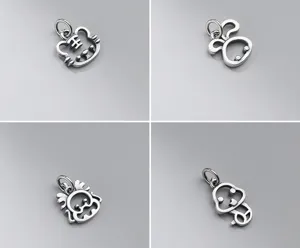Detailed view of four S925 sterling silver hollow zodiac charms with matte finish.