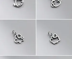 Detailed macro view of four various S925 matte silver hollow zodiac animal pendants