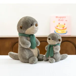 Cute and soft otter plush toy set with green knitted scarves as a birthday gift