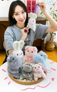 Cute plush animal keychain charms with bunny, pig, and hippo designs in various colors