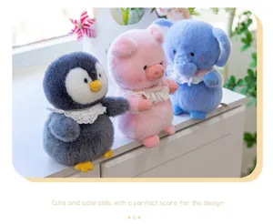 Detail view of cute animal plush toys including penguin, pig, and elephant with lace collars