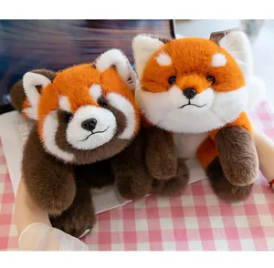 Detail view of two soft red panda plush toys with realistic fur texture and cute faces.