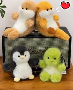 Group of four adorable puffy animal plush toy keychains, penguin and dinosaur styles