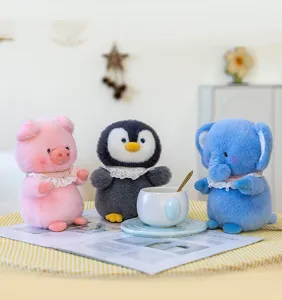 Cozy lifestyle group shot of cute plush pig, penguin, and elephant dolls in a tea scene