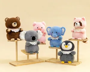 Detailed view of six cute forest animal plush toy dolls on tiered wooden display stands