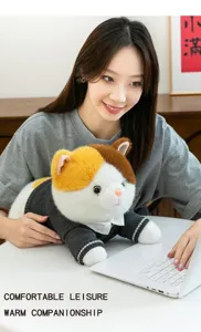 Detailed view of a cute plush cat toy wearing a grey sweater in a cozy home setting