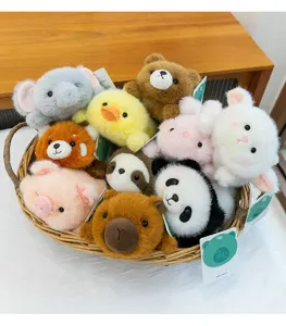Detailed view of various cute mini plush animal toys displayed inside a woven basket