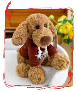 Cute brown plush dog toy wearing a burgundy hoodie with white drawstrings detail.